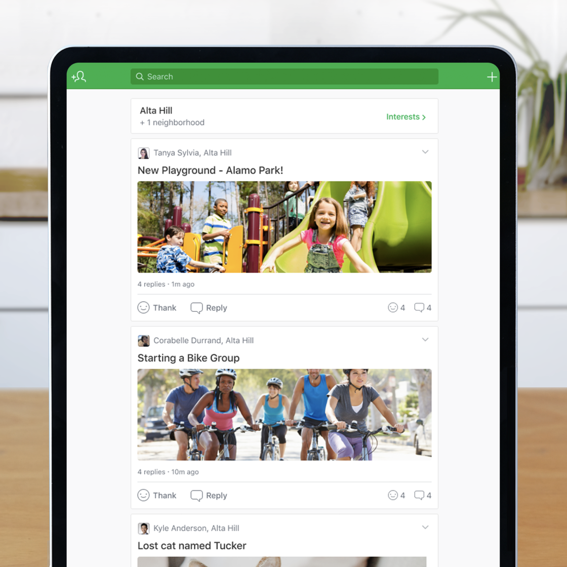 An image of an iPad showcasing the home feed of the Nextdoor app. The app shows posts of people enjoying a park and riding bikes as a group.